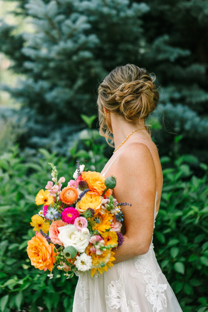 Details of the bride's updo and bouquet at spruce mountain ranch