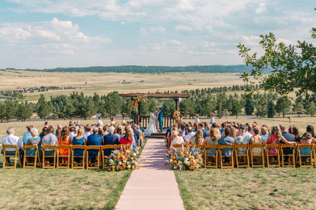 Bride and Groom exchanging vows during ceremony at Spruce Mountain Ranch