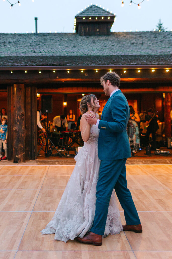 Couple's first dance surrounded by friends and family at Spruce Mountain Ranch